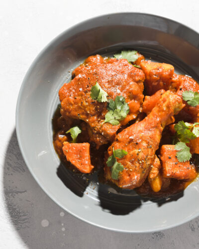Punchy aromatics brighten the saucy chicken braise of Nigerian red stew